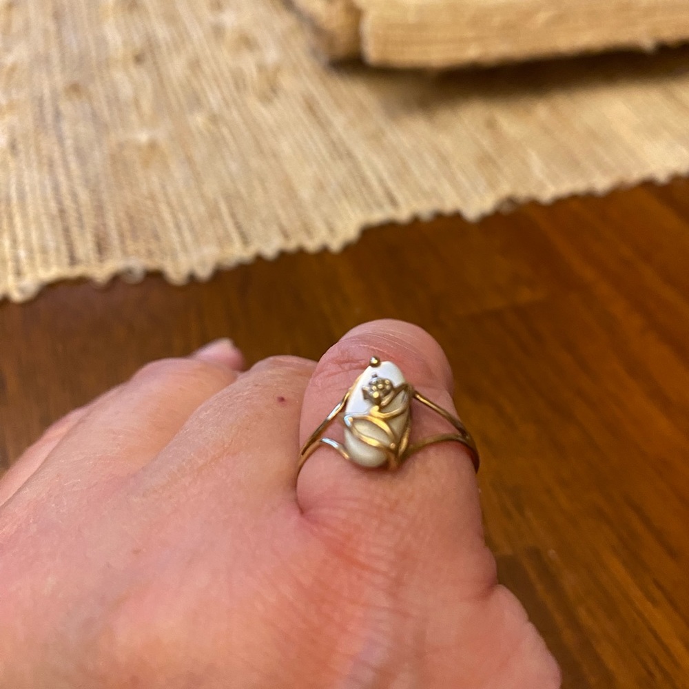 Mother of Pearl ring size 6. 14 karat band.